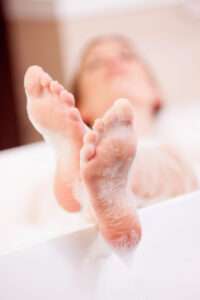 Woman bathing in softened water