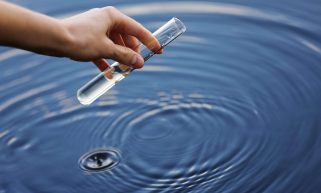 Scientist collecting water sample
