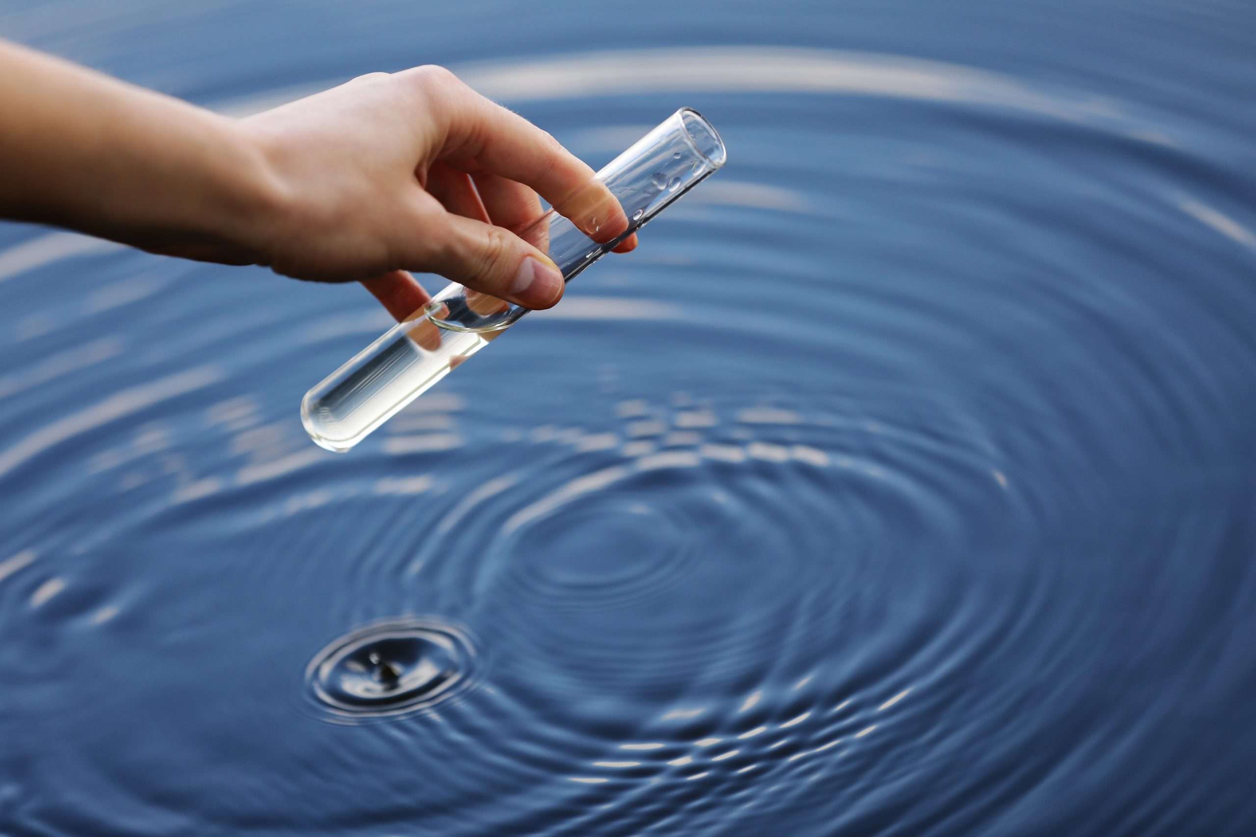 Scientist collecting water sample