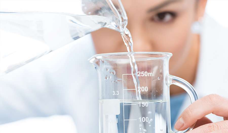 Scientist testing fluoride in tap water